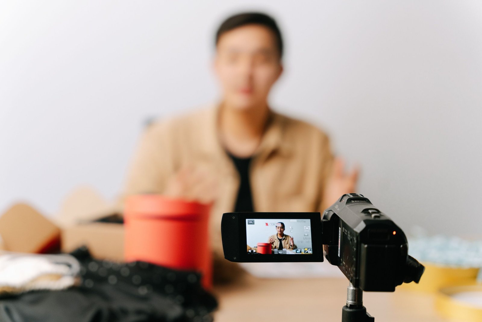 Content creator recording a video in front of a camera for YouTube chapters SEO